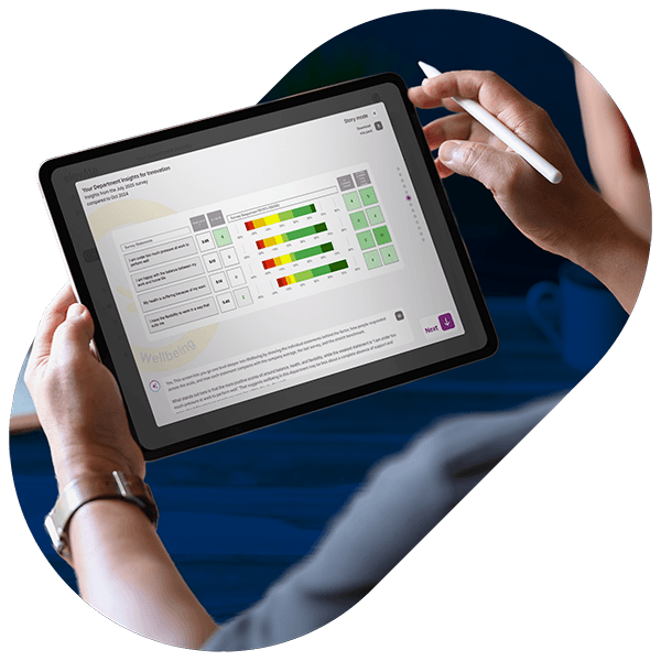 Person holding a tablet showing a wellbeing survey with colored bar charts and a digital pen in the other hand.