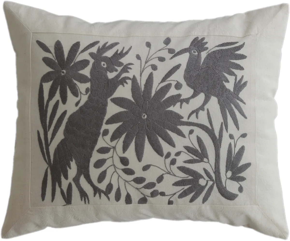 Hand-embroidered rectangular cushion cover, made in Mexico.