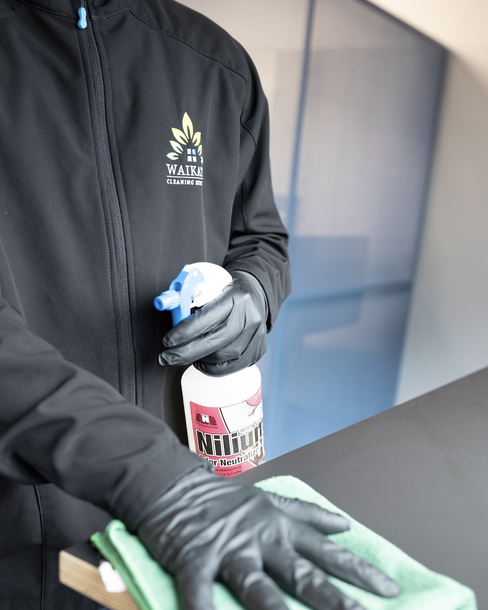 Cleaner completing a detailed commercial surface clean