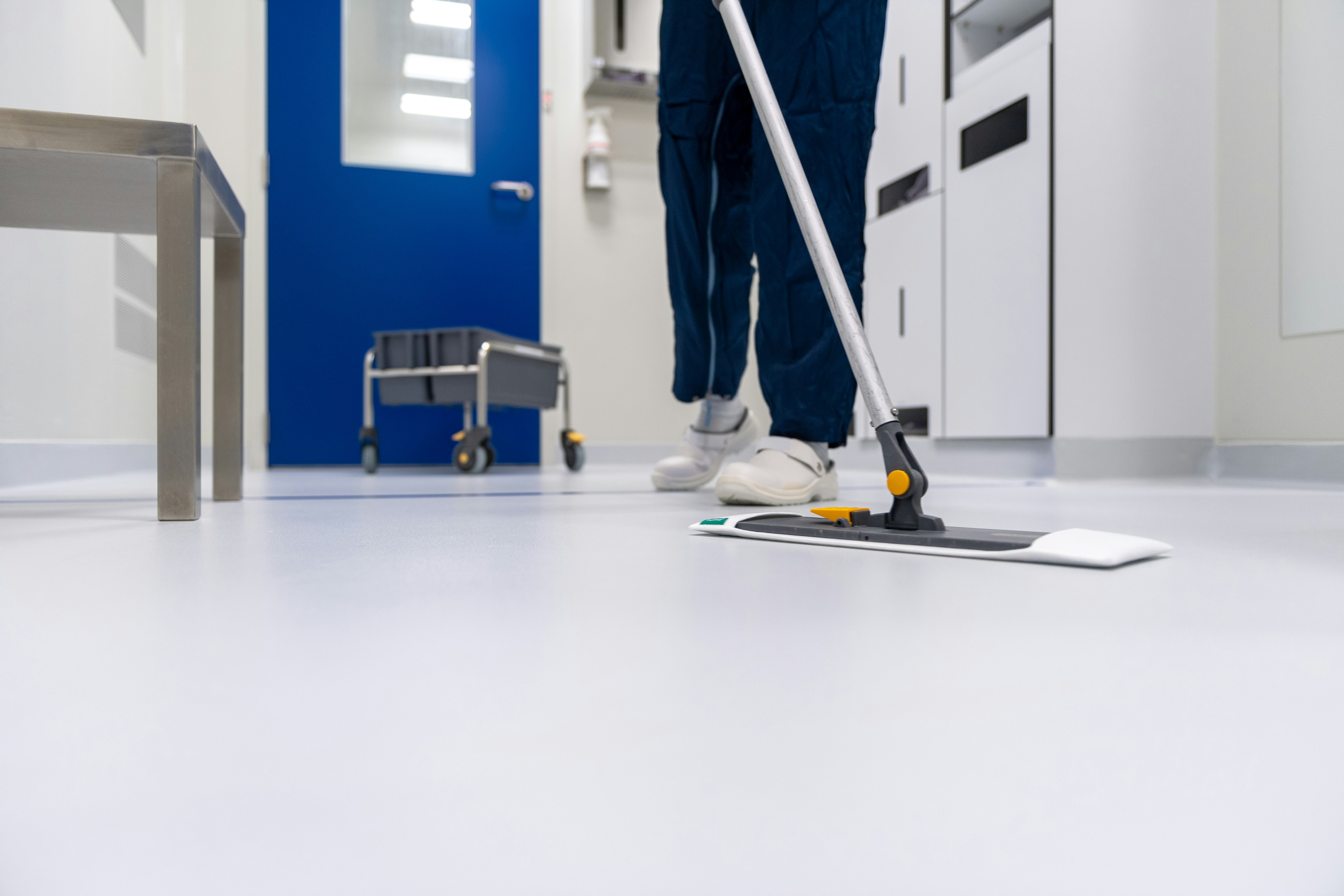 Commercial cleaner mopping a vinyl floor