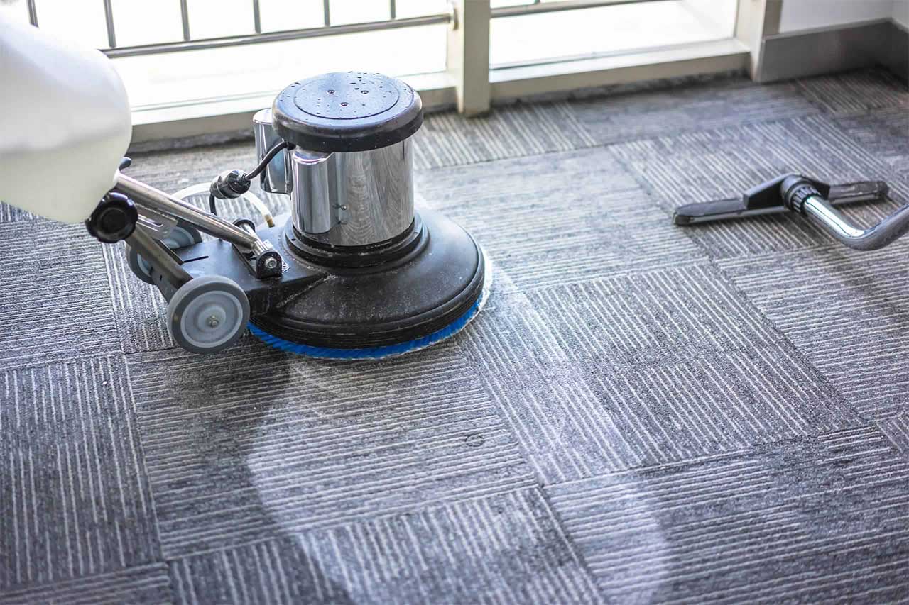 Commercial carpet cleaning with a scrubber