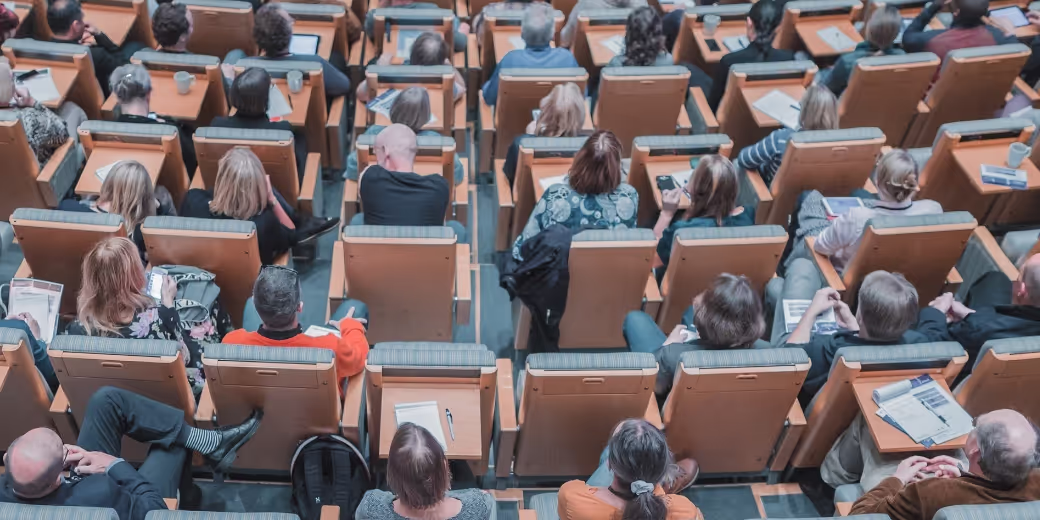 University classroom with filled seats, seen from above
