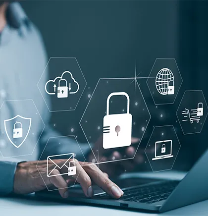 Person using a laptop with digital icons of padlocks, cloud storage, email, shield, globe, and shopping cart representing cybersecurity and data protection.