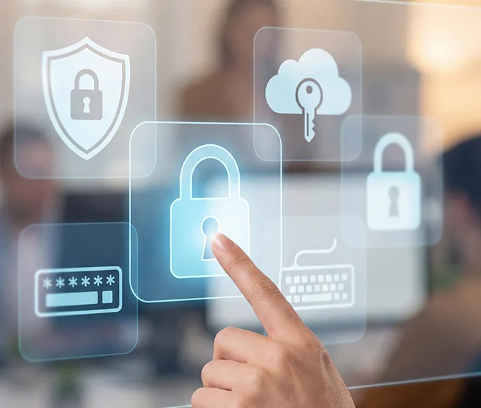 Hand touching a digital lock icon on a transparent screen surrounded by security icons including a shield, cloud with key, password, and keyboard.