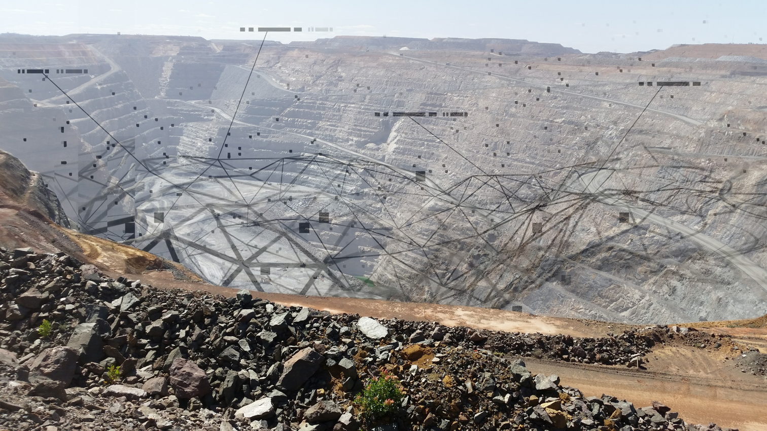 Open pit, connected by data.