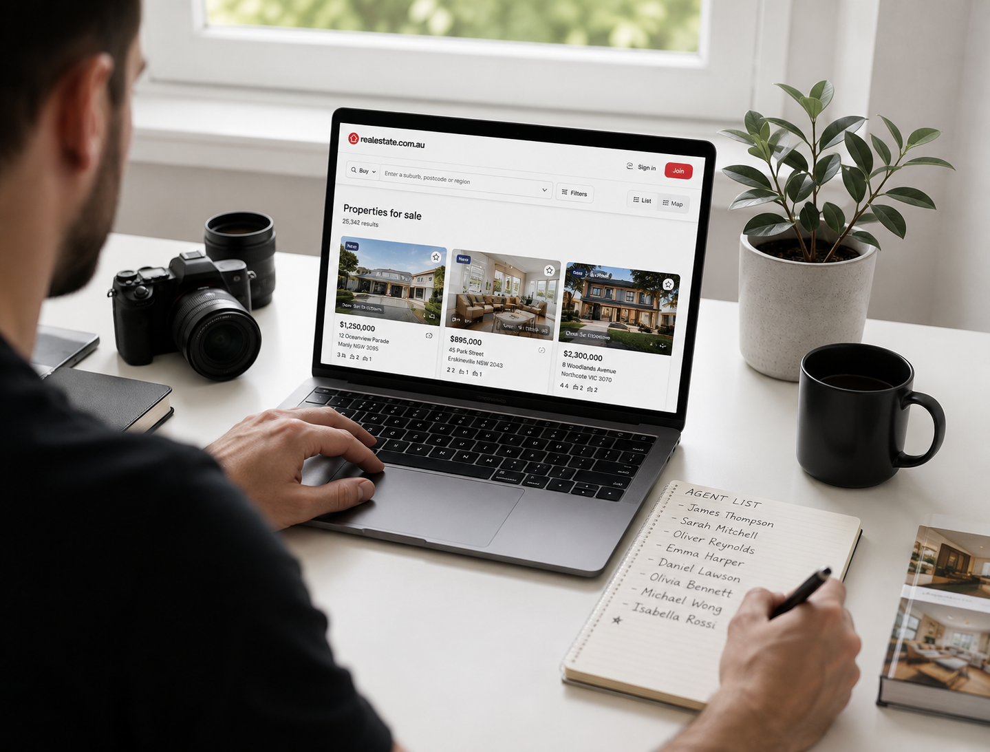 Photographer researching listings on a laptop to find real estate agents who need virtual tours