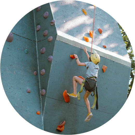A child climbing a climbing wall
