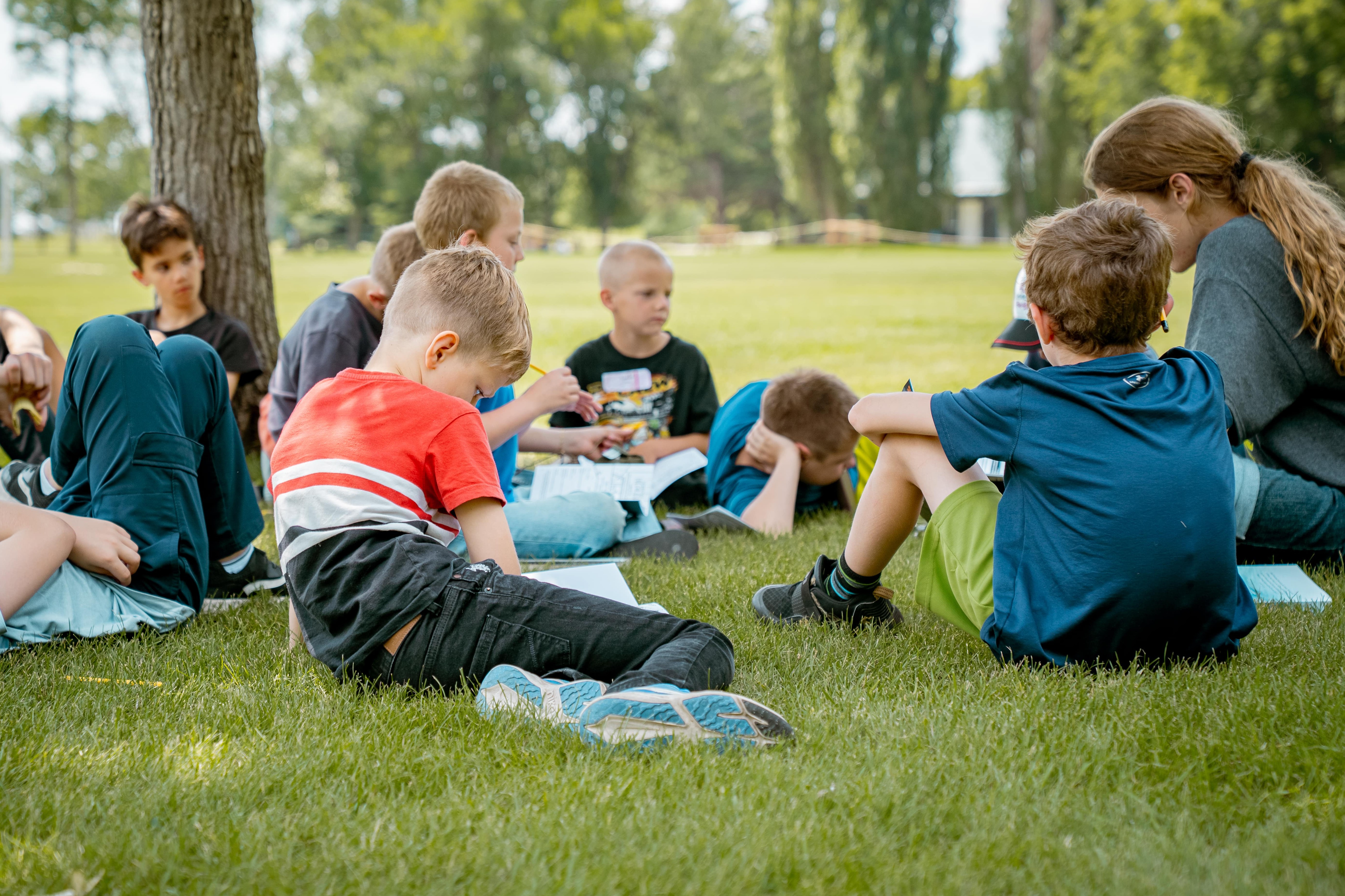 Group of children reading the bible.