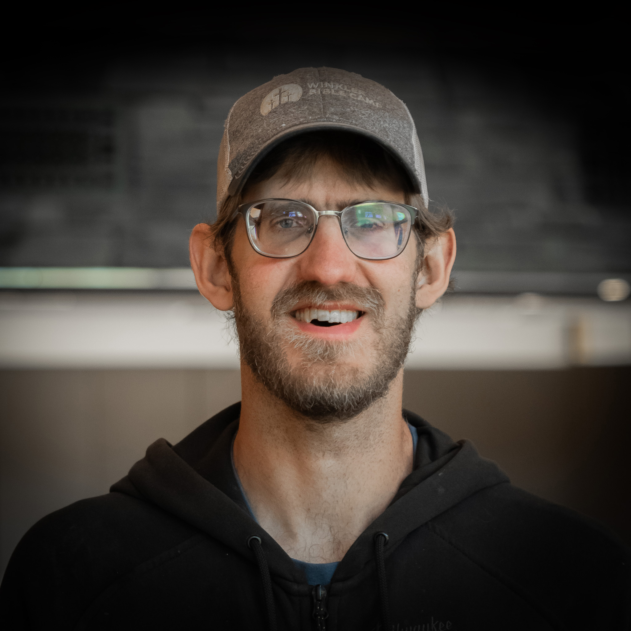 man with beard, glasses and beanie