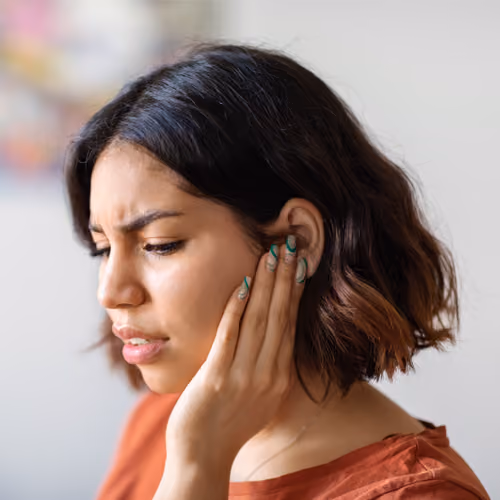 woman with ear discomfort