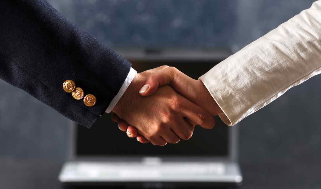 Executives shaking hands
