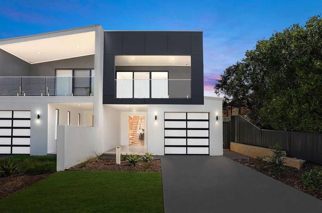 Panania knockdown rebuild – completed new duplex by Sydbuilt at dusk