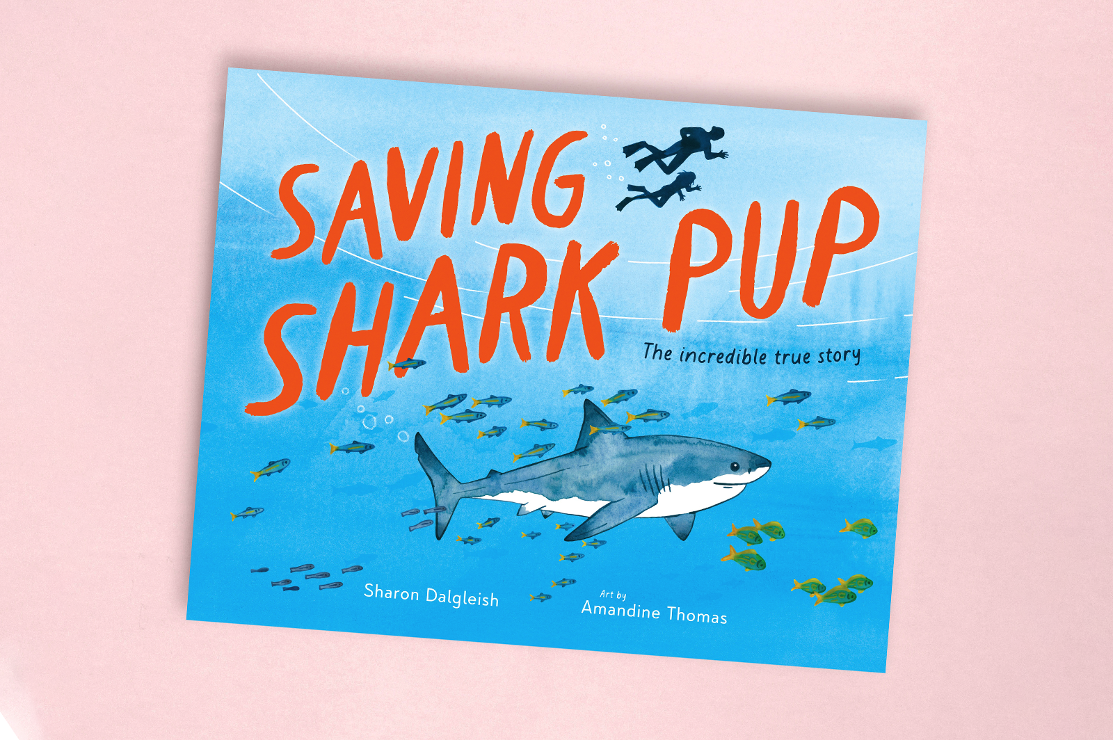 The cover of Saving Shark Pup, showing a great white shark swimming with divers.