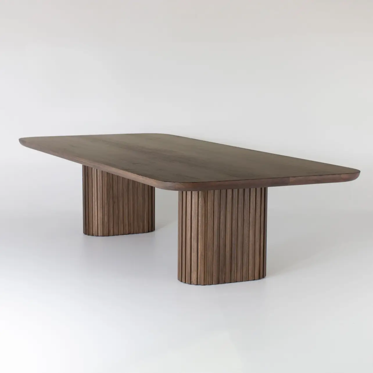 The Albert Malki table has a sleek look with a long rectangular top and two wide rectangular legs made up of vertical slats
