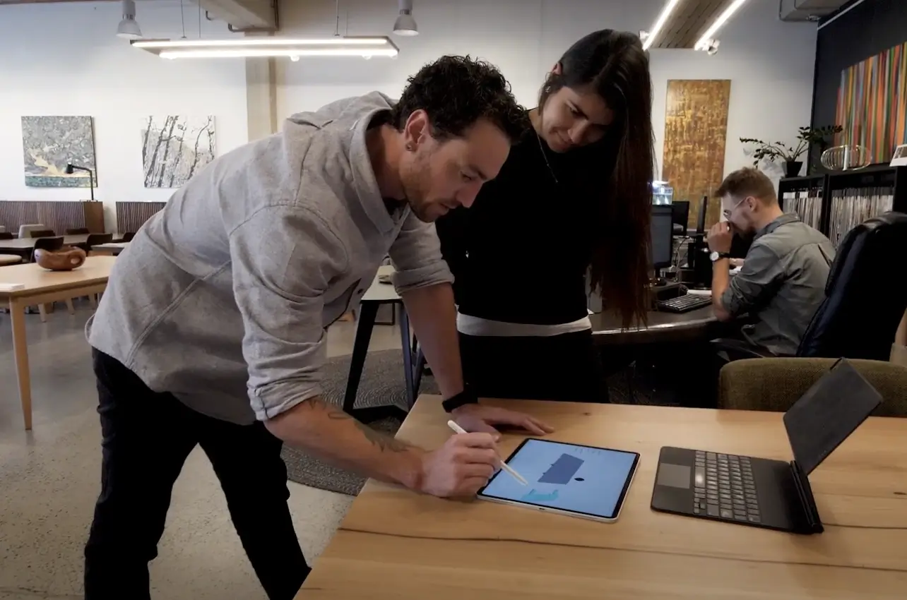 Marc, Eclipse Furniture Owner, 3D models a furniture piece on Shapr3D with a client looking on