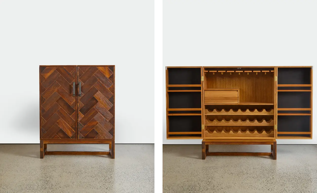 The Gerald Liquor Cabinet has an ornate structure for the two front doors made up of intersecting, wide rectangular slats