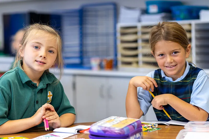 girls at desks in classroom