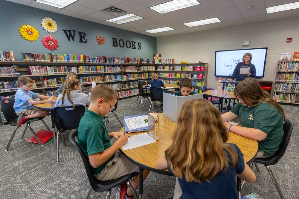 students reading in roncalli library