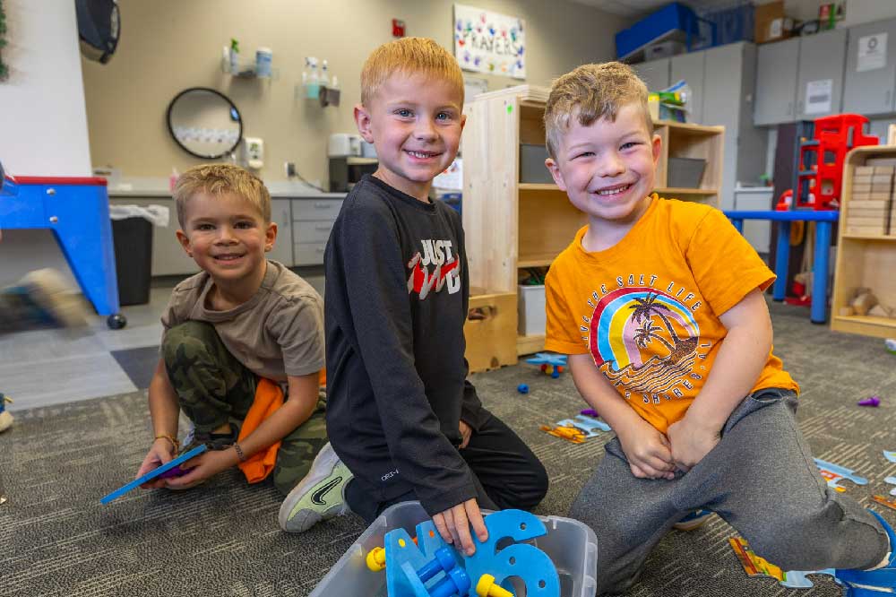 pre school boys playing with toys