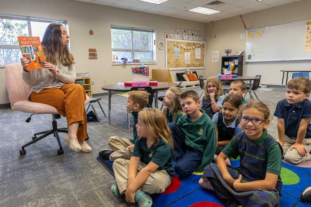 teacher reading to group of students