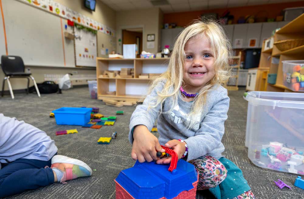 student playing with toys