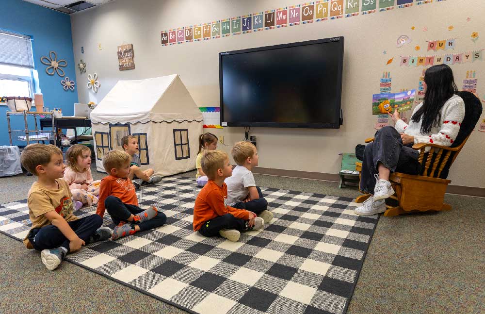 teacher reading to group of students