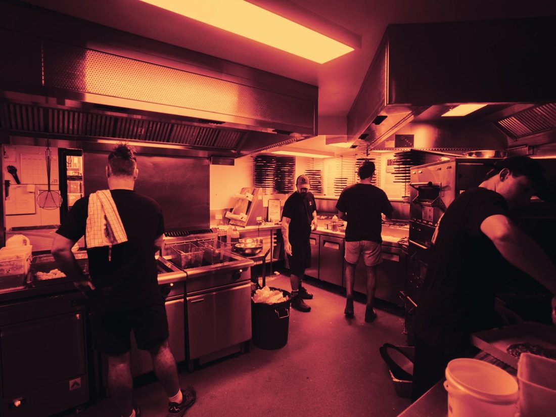 A busy commercial kitchen line