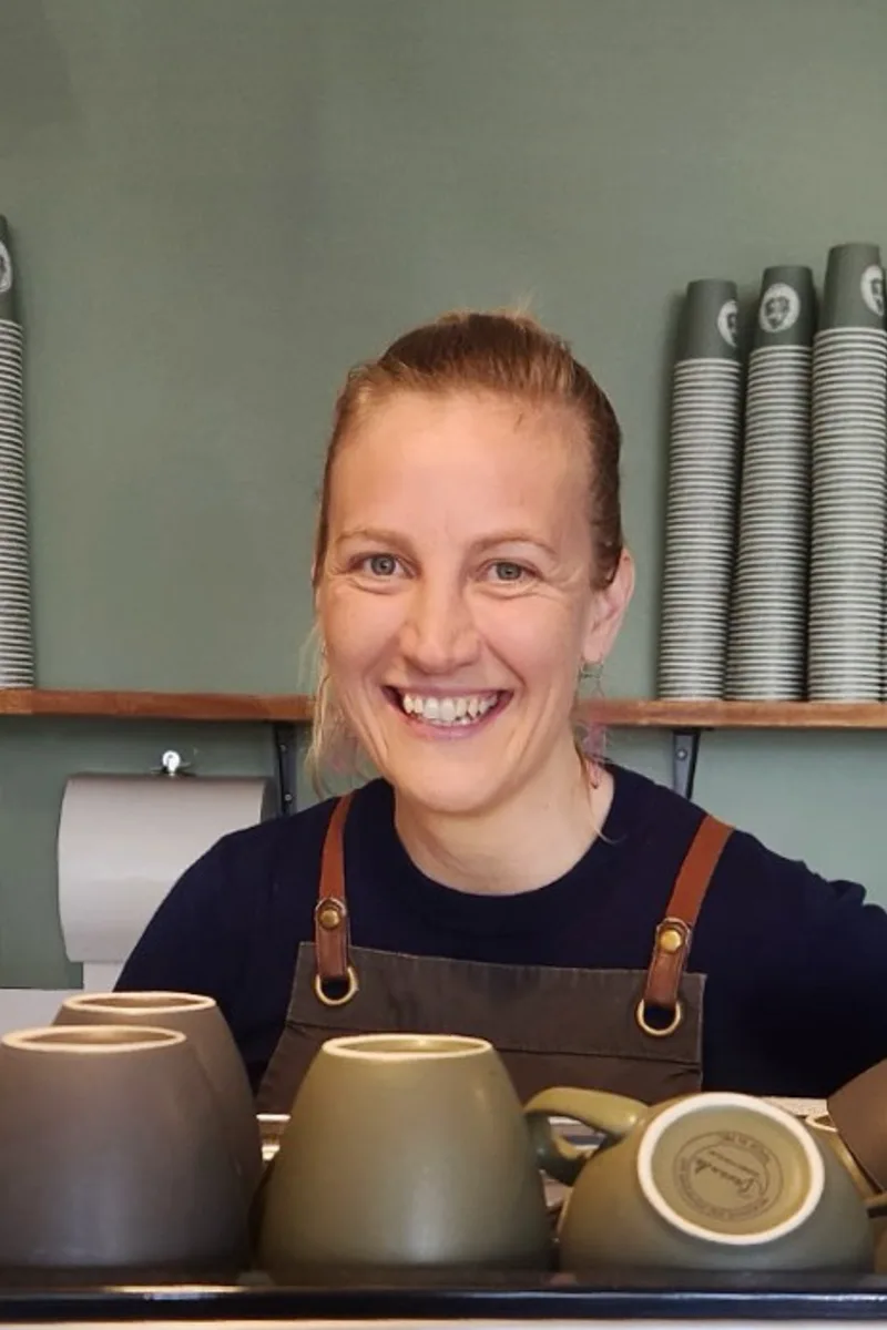Barista behind the counter at a cafe