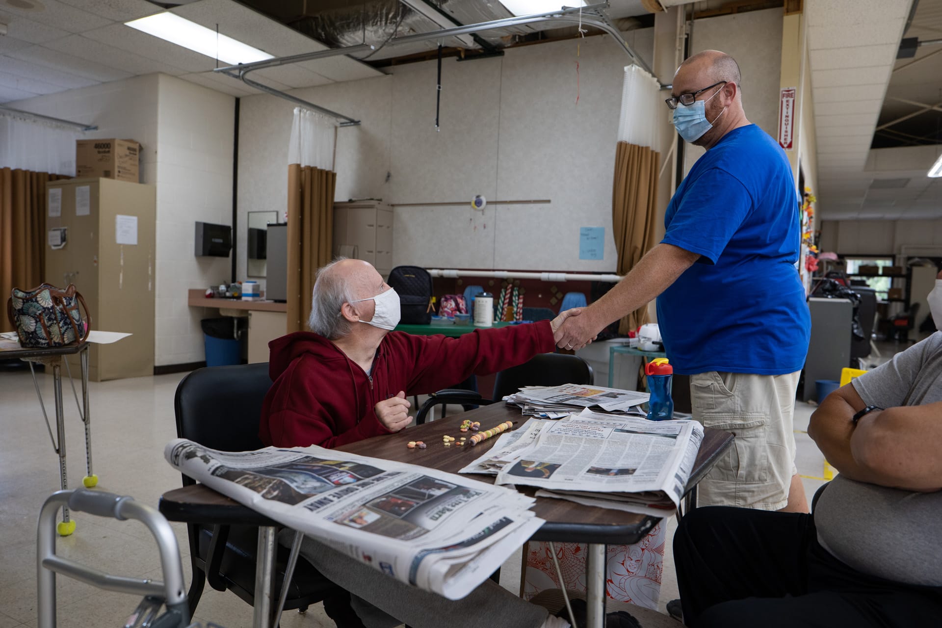 Staff member assisting an individual receiving services through Wayne County Board of Developmental Disabilities.