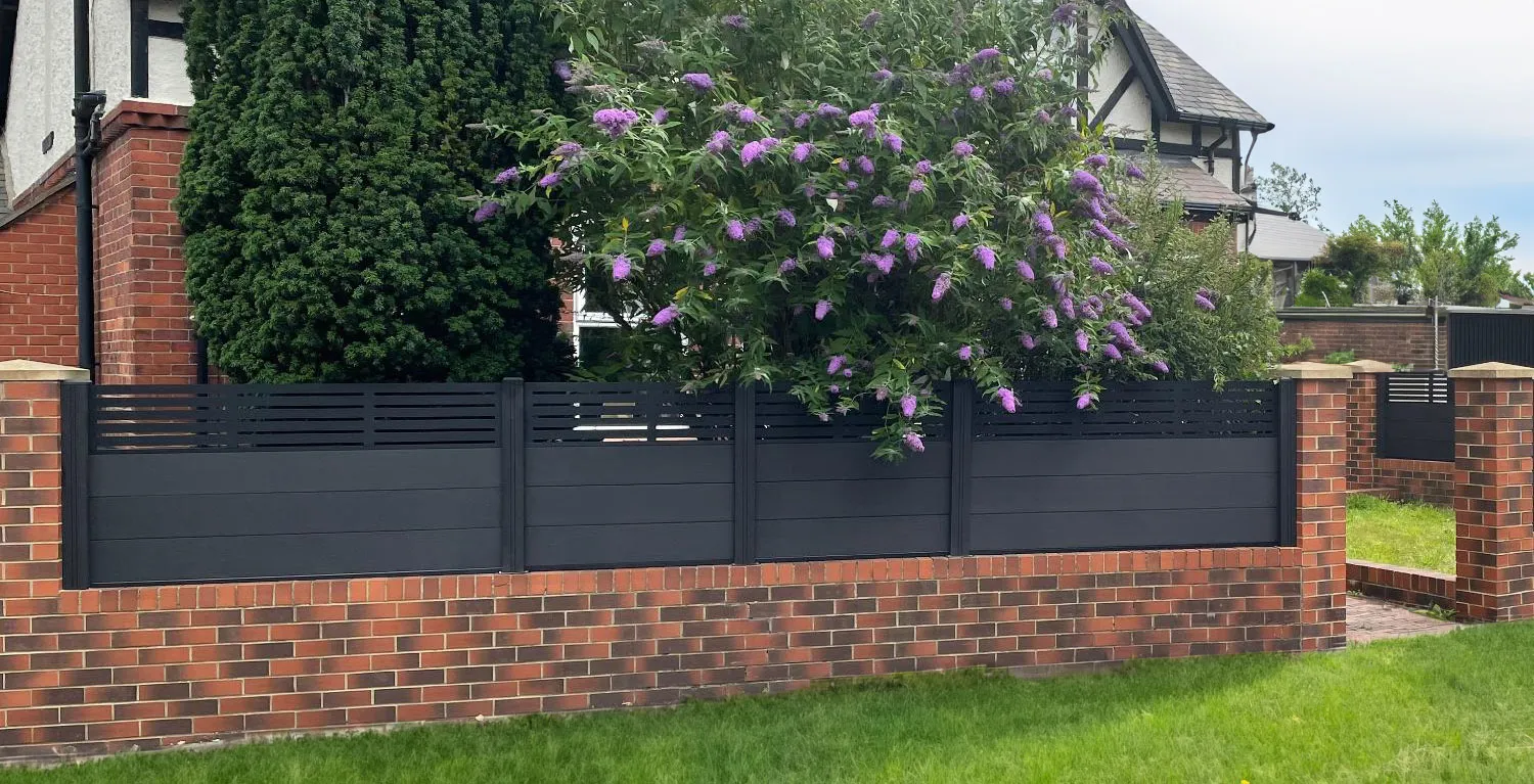 Composite fence installation combined with a facebrick wall
