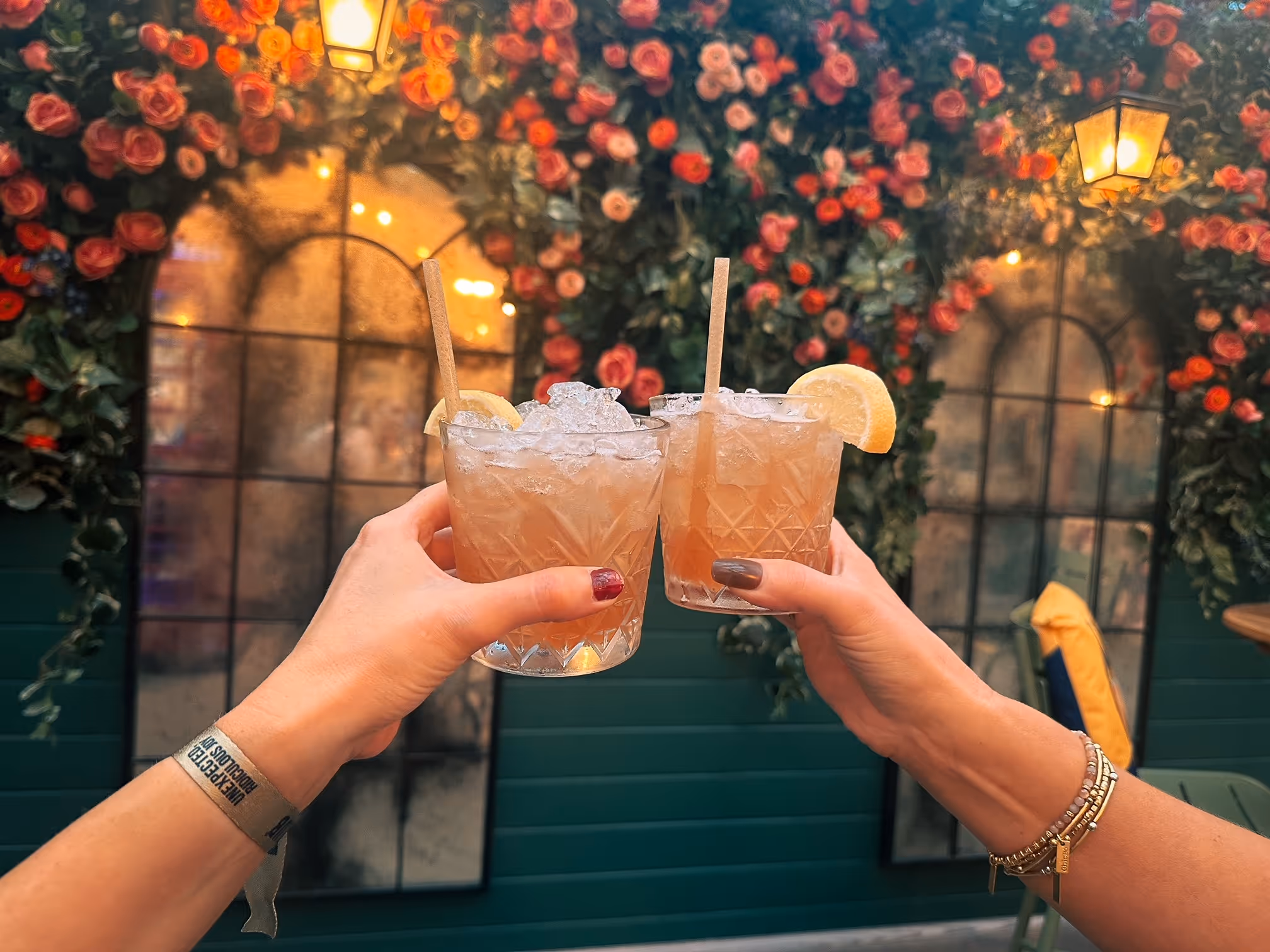 Guests capturing memories with cocktails at Flight Club's summer terrace