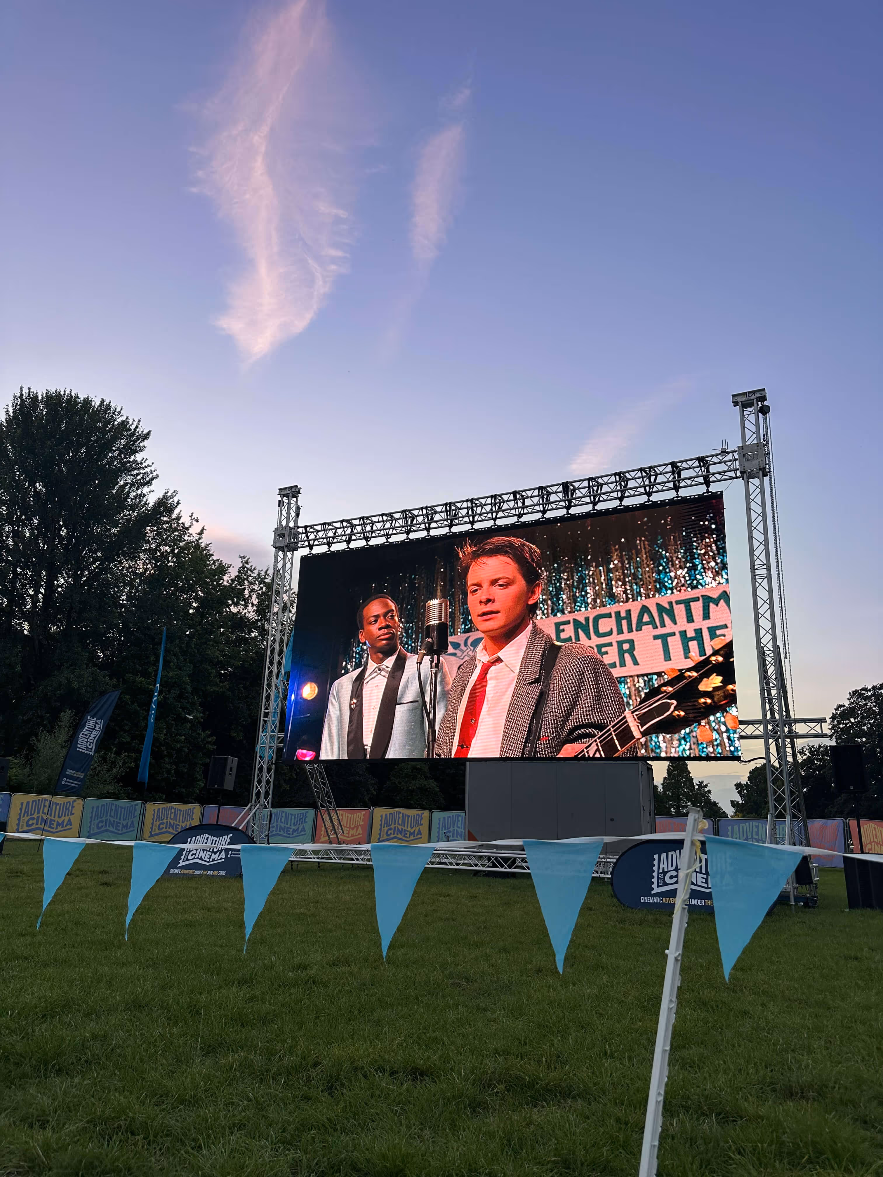 Adventure Cinema’s outdoor screening setup with large screen and deck chairs in Bute Park