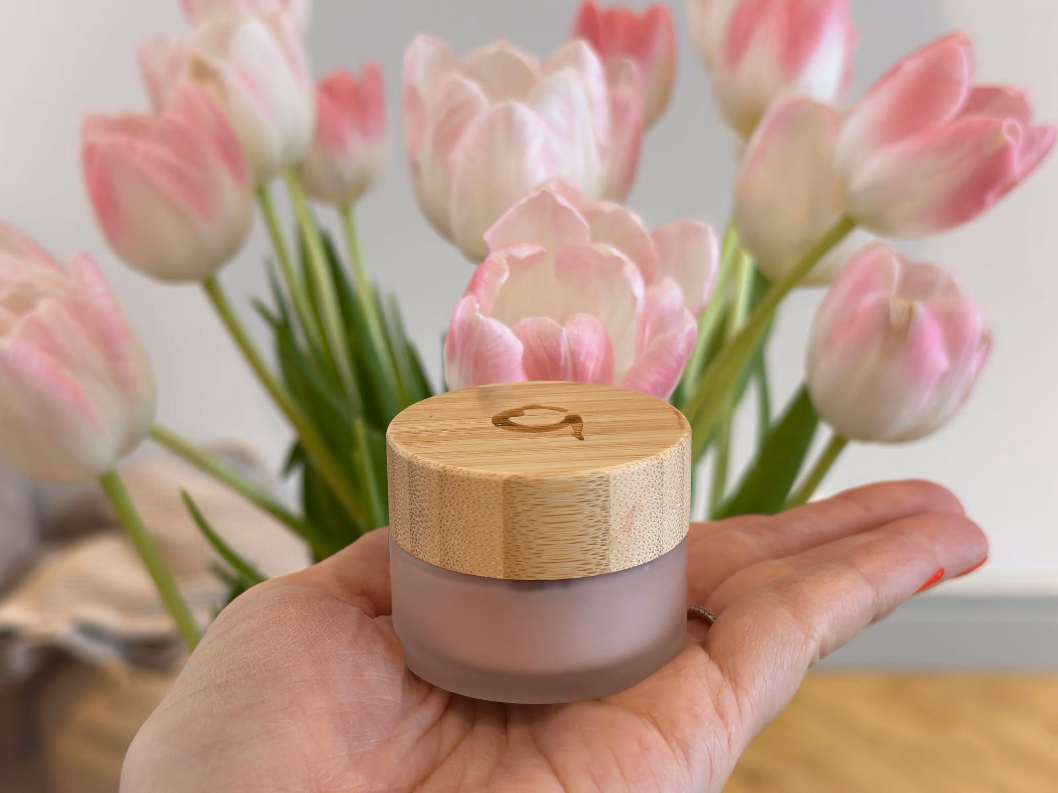 Gaia Skincare Crystal Purifying Mask in a glass jar with a deep pink hue, known for its antioxidant-rich and skin-rejuvenating properties.