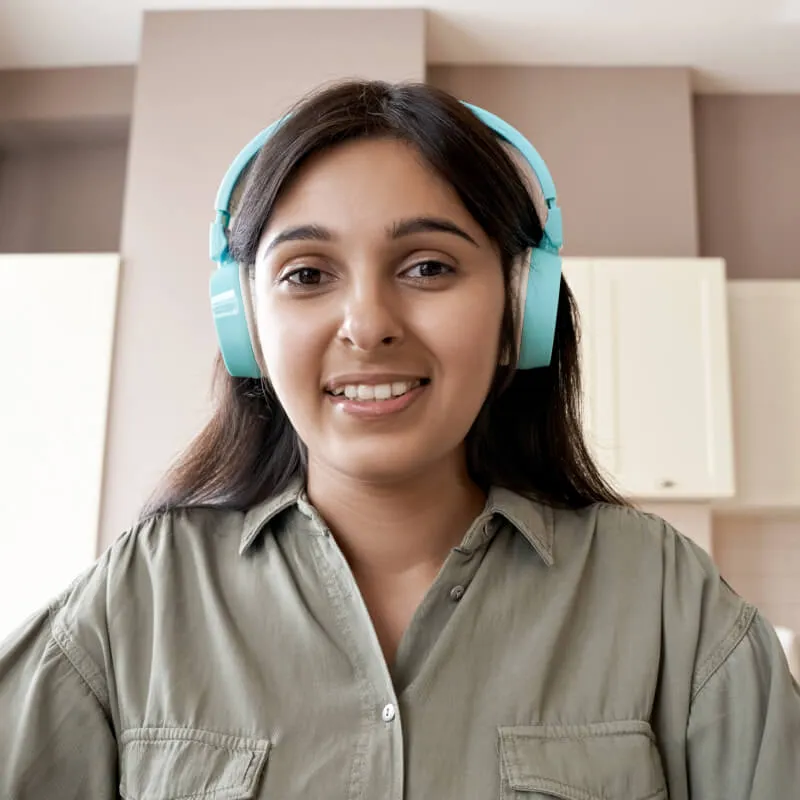 virtual attendee of woman at home wearing headphones