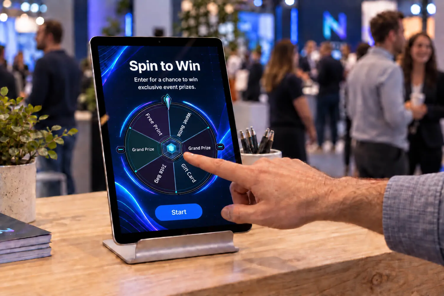 Guest tapping a Spin to Win wheel on a branded tablet kiosk at an event booth