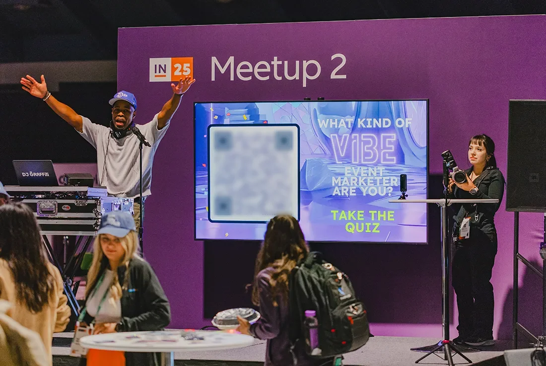 qr code ad on stage at live event for attendees to participate in the photo booth