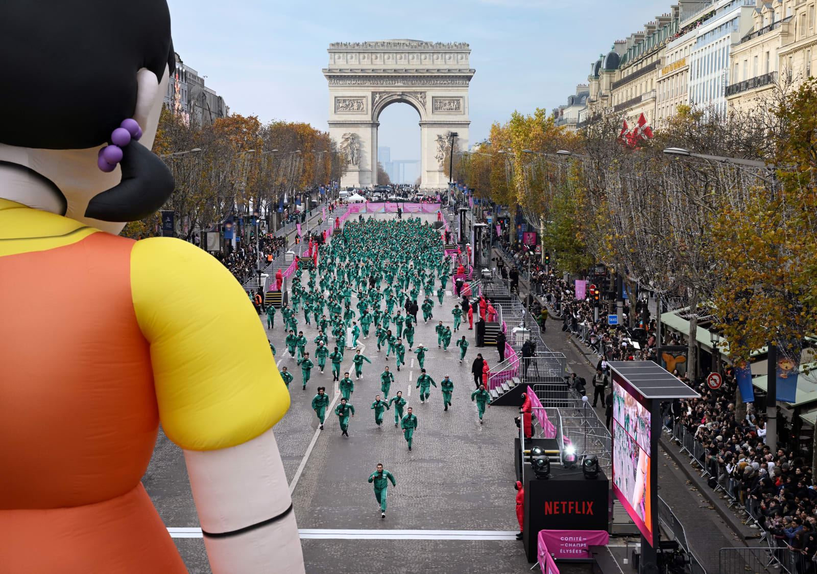 Netflix Squid Game Red Light Green Light activation on the Champs-Élysées in Paris with giant Young-hee doll