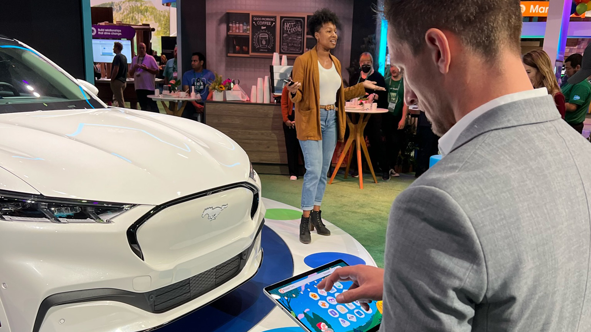 Salesforce and Ford interactive multiplayer game show activation at Dreamforce featuring a Ford Mach-E on a rotating stage with LED displays and touchscreen stations