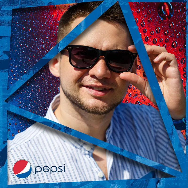 Photo booth snapshot of a guest in sunglasses on a shattered blue Pepsi frame