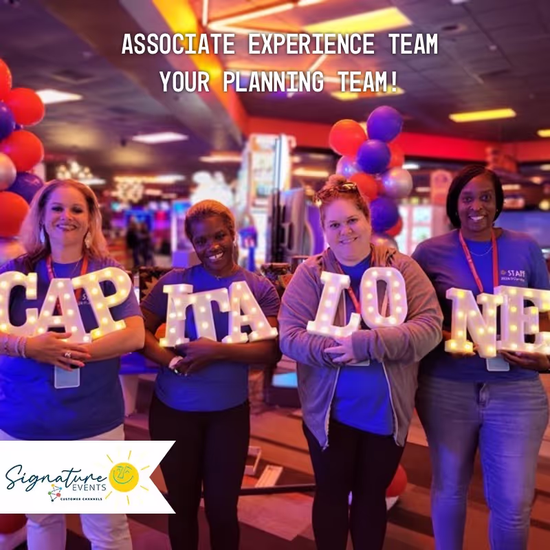 Photo booth snapshot of four teammates holding Capital One marquee letters on a Signature Events frame