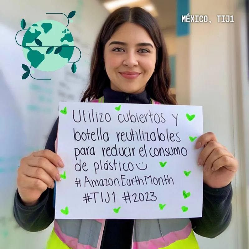 Photo booth snapshot of a guest holding a handwritten pledge sign on an Amazon Earth Month frame from Tijuana