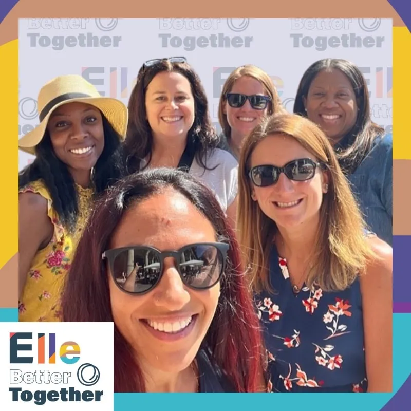 Photo booth snapshot of six guests in a sunny group selfie on an Elle Better Together frame