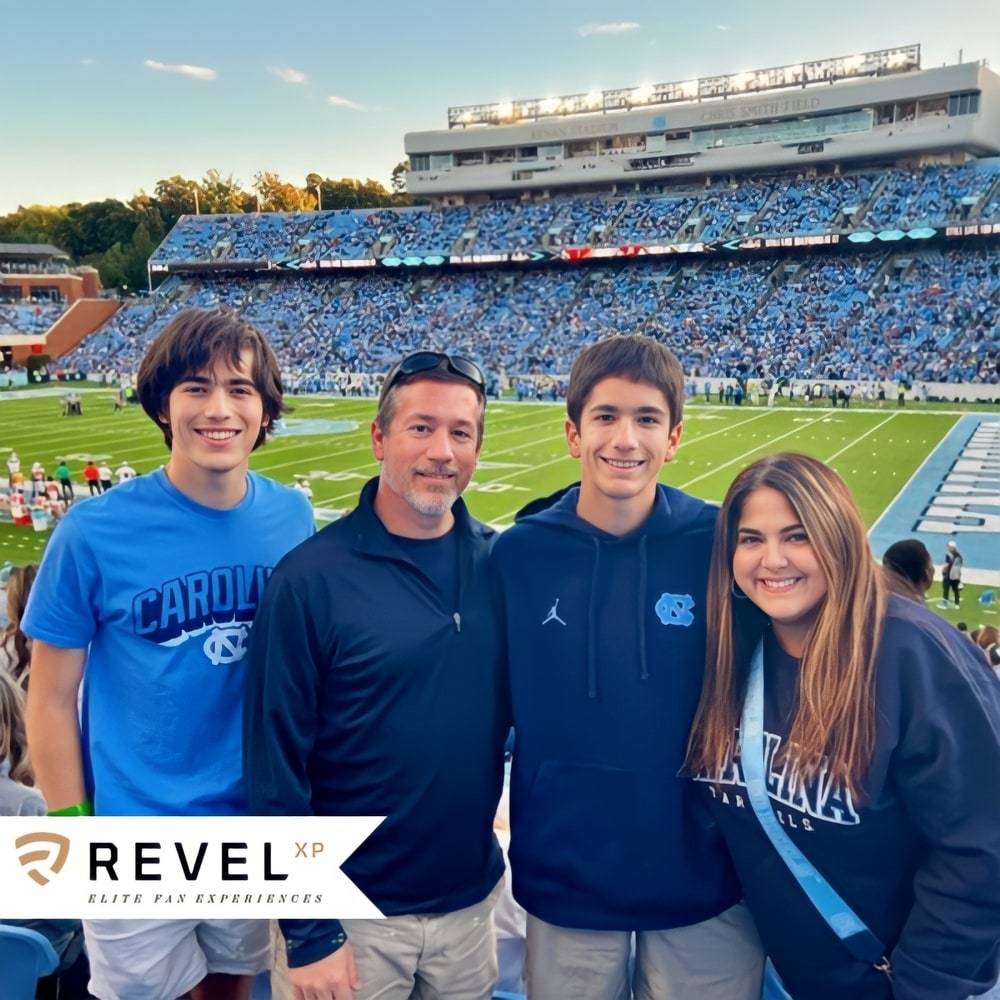 Photo booth snapshot of a family at a Carolina football stadium on a RevelXP elite fan experiences frame