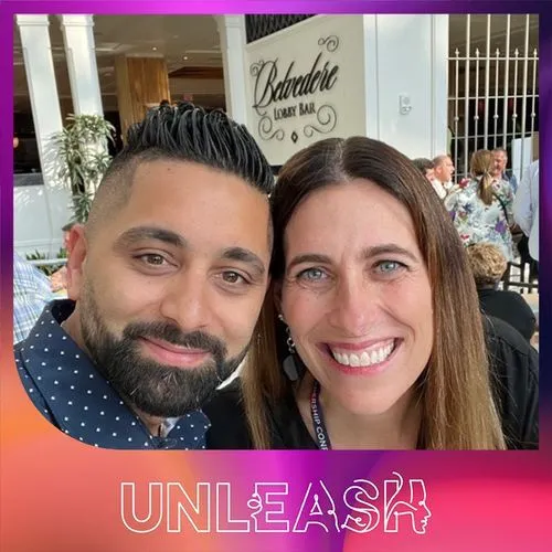 Photo booth snapshot of two guests in a close selfie on an Unleash conference frame
