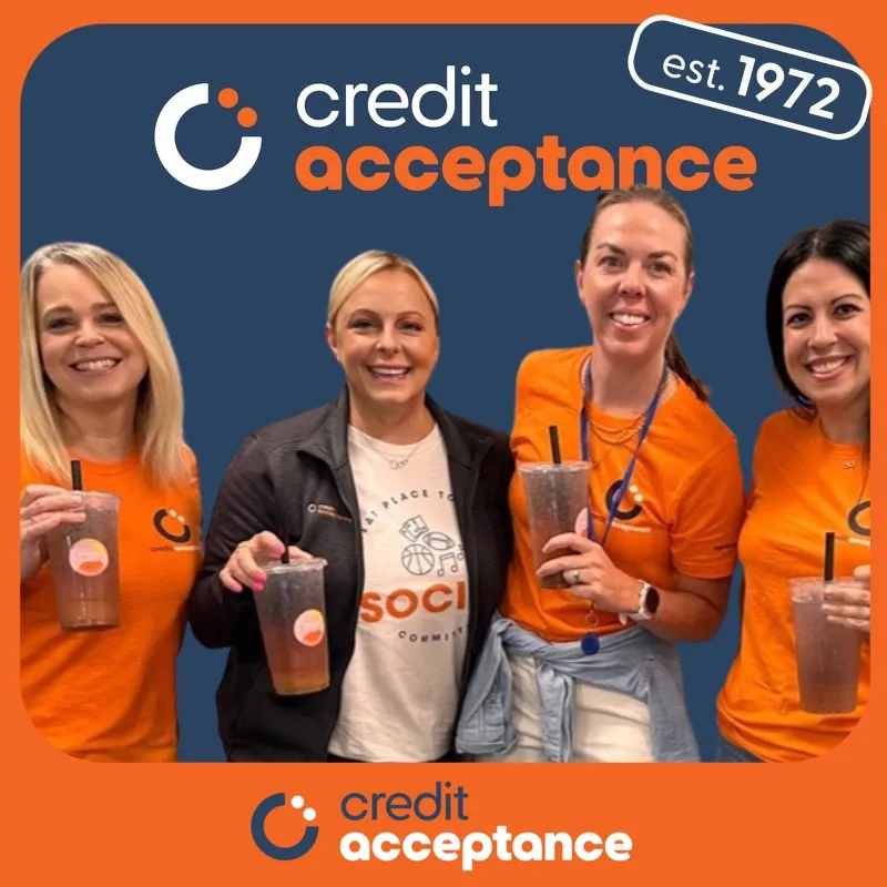 Photo booth snapshot of four teammates raising iced drinks on a Credit Acceptance frame