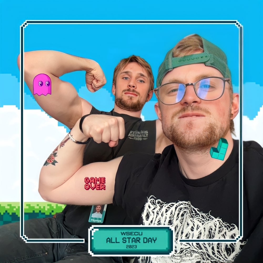 Photo booth snapshot of two guests flexing on a pixel video game frame for WSECU All Star Day