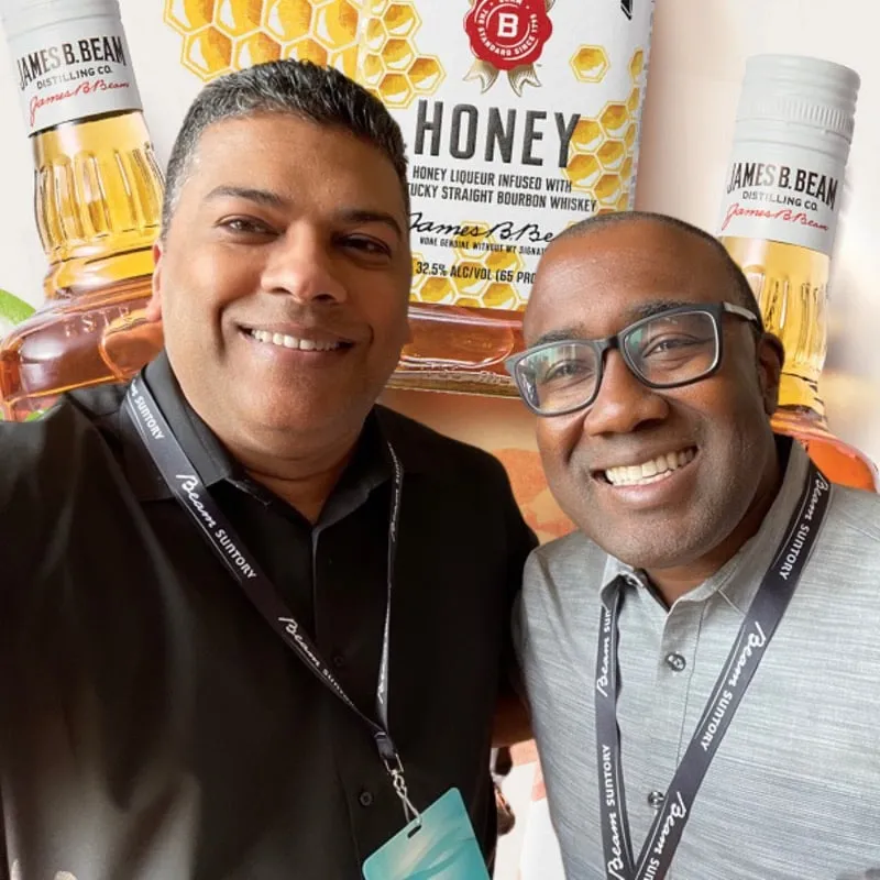 Photo booth snapshot of two guests at a James B. Beam honey liqueur display