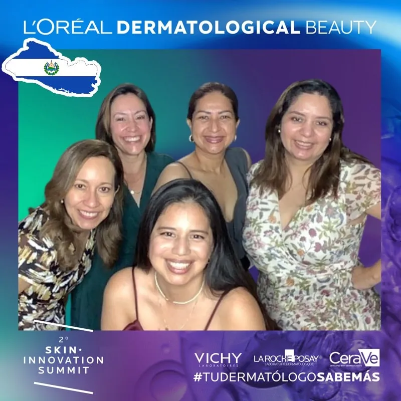 Photo booth snapshot of five guests on a L'Oreal Dermatological Beauty Skin Innovation Summit frame
