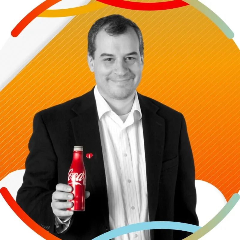 Photo booth snapshot of a black and white portrait of a guest holding a red Coca-Cola bottle on an orange frame