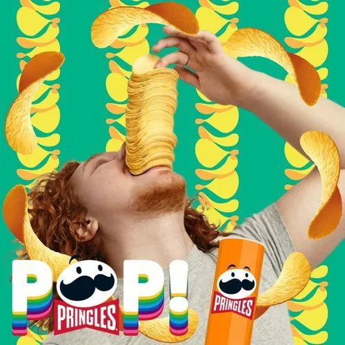 Photo booth snapshot of a guest catching a tall stack of chips in his mouth on a Pringles Pop frame